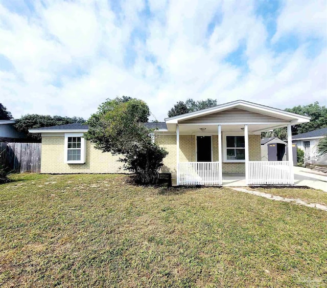 view of front facade with covered porch and a front lawn