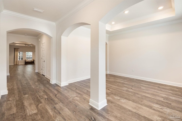 interior space with crown molding, dark hardwood / wood-style floors, and ceiling fan