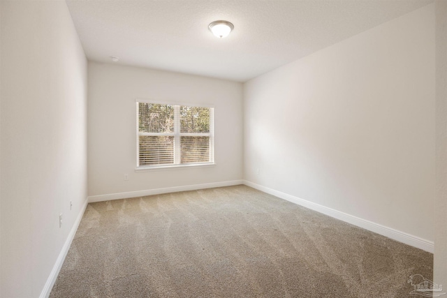 empty room with carpet flooring