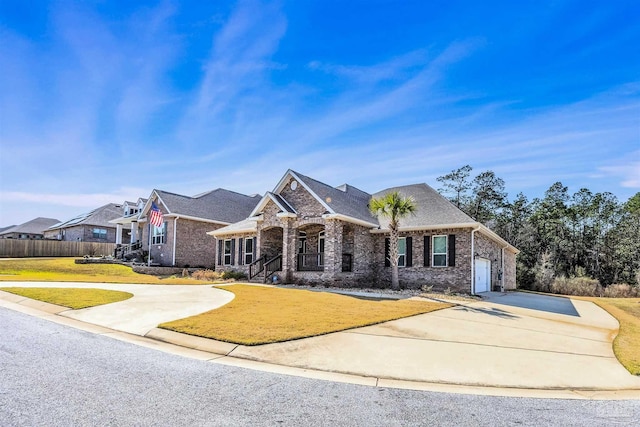 view of front facade with a garage and a front yard