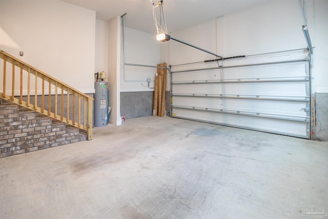 garage featuring a garage door opener and electric water heater