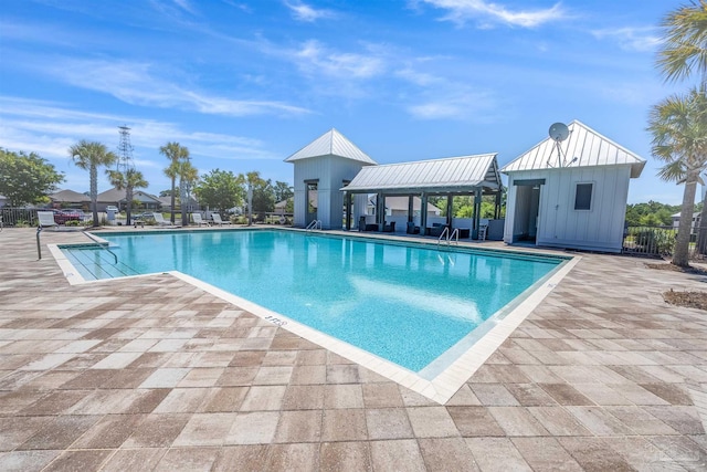 view of swimming pool featuring a patio