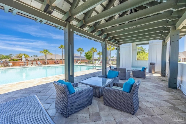 view of patio featuring a community pool and an outdoor living space