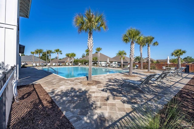 view of swimming pool with a patio