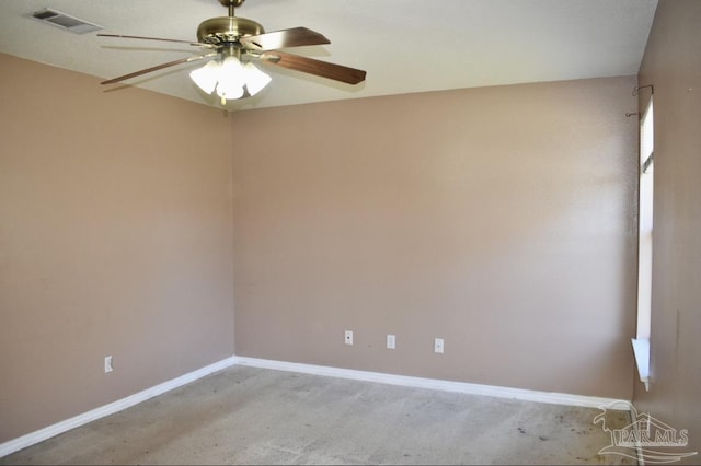 carpeted spare room with ceiling fan