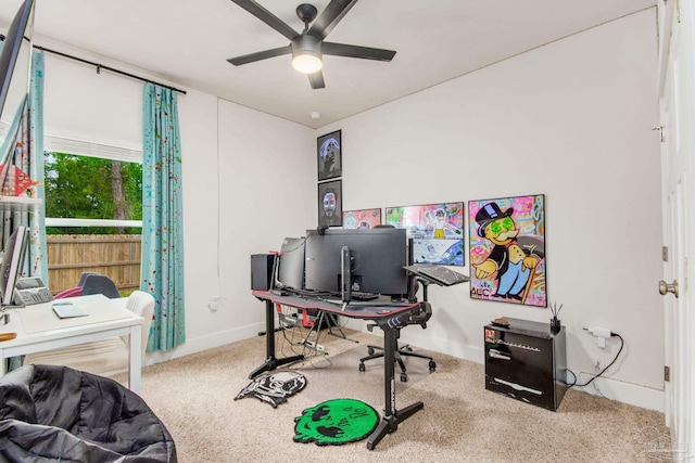 carpeted office featuring ceiling fan