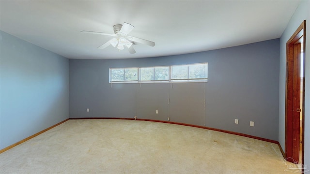 unfurnished bedroom with a ceiling fan, baseboards, and light colored carpet