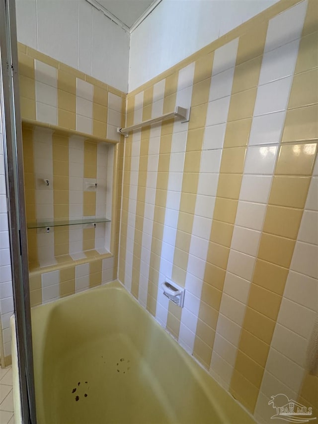 bathroom featuring a bathing tub and walk in shower