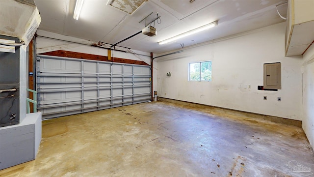 garage featuring a garage door opener and electric panel