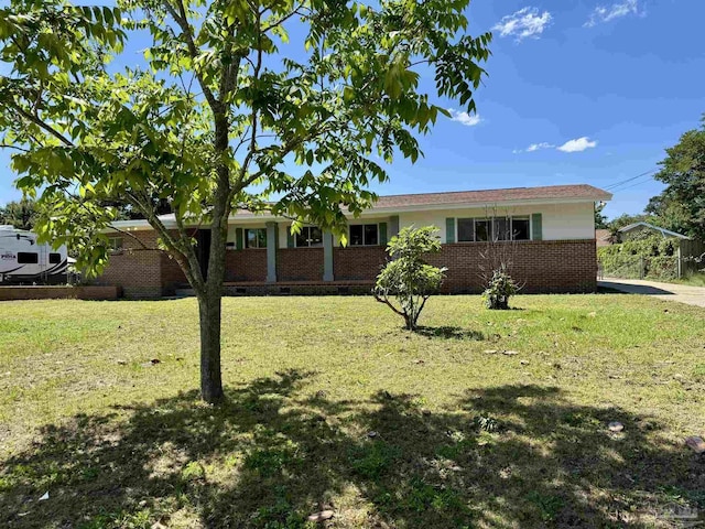 ranch-style house with brick siding and a front yard