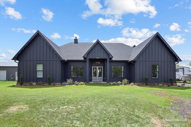 7664 Buffalo Ridge Rd, Pace, FL 32571 - modern inspired farmhouse with board and batten siding, roof with shingles, a front lawn, and french doors