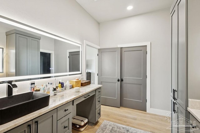 7664 Buffalo Ridge Rd, Pace, FL 32571 - bathroom with wood finished floors, vanity, and recessed lighting