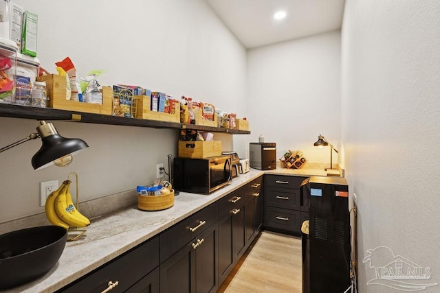 7664 Buffalo Ridge Rd, Pace, FL 32571 - bar area with black microwave, light wood finished floors, and recessed lighting