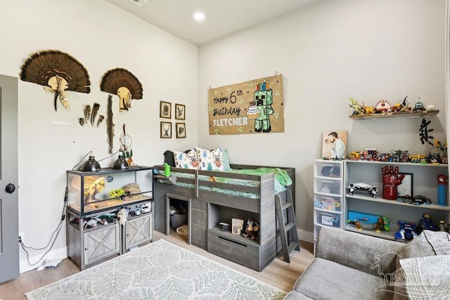 7664 Buffalo Ridge Rd, Pace, FL 32571 - home office with wood finished floors and recessed lighting