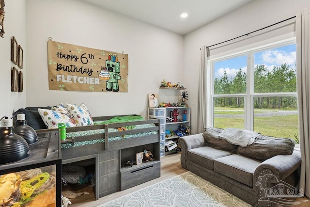 7664 Buffalo Ridge Rd, Pace, FL 32571 - bedroom with recessed lighting and wood finished floors