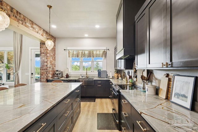 7664 Buffalo Ridge Rd, Pace, FL 32571 - kitchen featuring electric range oven, light stone counters, light wood-style floors, decorative light fixtures, and recessed lighting