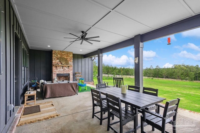 7664 Buffalo Ridge Rd, Pace, FL 32571 - view of patio featuring an outdoor living space with a fireplace, outdoor dining area, and ceiling fan