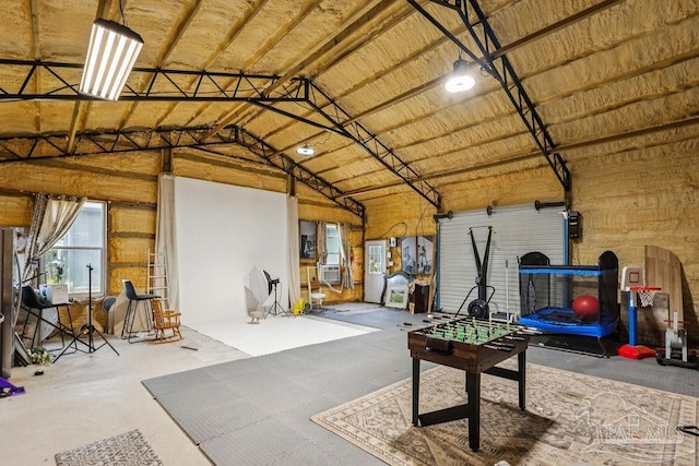 7664 Buffalo Ridge Rd, Pace, FL 32571 - rec room featuring high vaulted ceiling and concrete floors