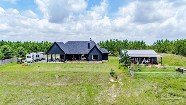 7664 Buffalo Ridge Rd, Pace, FL 32571 - back of property featuring a chimney, a patio, a shingled roof, and board and batten siding