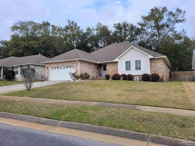 ranch-style house with a garage, brick siding, fence, driveway, and a front lawn