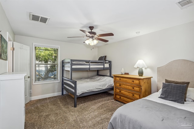 bedroom featuring ceiling fan and dark carpet