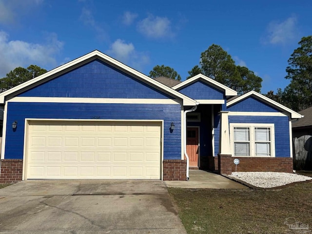 ranch-style house featuring driveway, brick siding, and an attached garage