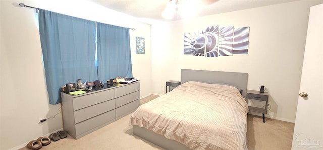 bedroom featuring light colored carpet