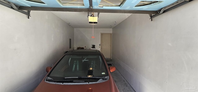 garage featuring a garage door opener