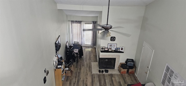 living room featuring hardwood / wood-style floors and a textured ceiling