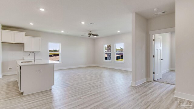 1674 Amaya Ln, Gulf Breeze, FL 32563 - kitchen featuring healthy amount of natural light, a sink, light wood-style floors, a ceiling fan, and recessed lighting