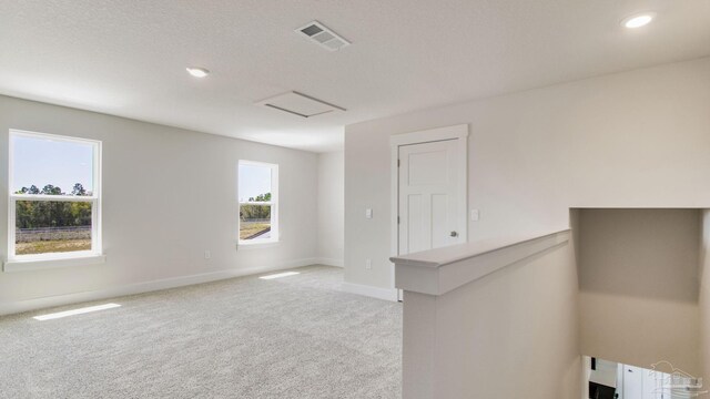 1674 Amaya Ln, Gulf Breeze, FL 32563 - spare room with light carpet, baseboards, and recessed lighting