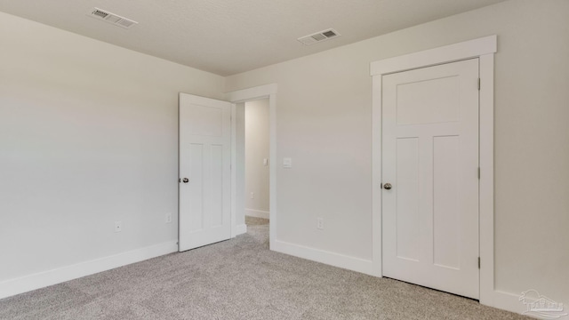 1674 Amaya Ln, Gulf Breeze, FL 32563 - unfurnished bedroom featuring light carpet and baseboards