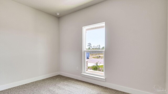 1674 Amaya Ln, Gulf Breeze, FL 32563 - spare room with light carpet, baseboards, and a smoke detector
