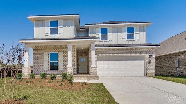 1674 Amaya Ln, Gulf Breeze, FL 32563 - view of front facade featuring brick siding, a garage, board and batten siding, and concrete driveway
