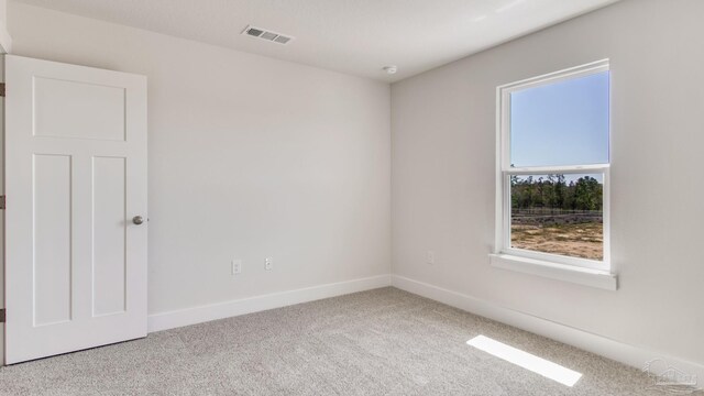 1674 Amaya Ln, Gulf Breeze, FL 32563 - carpeted spare room featuring baseboards