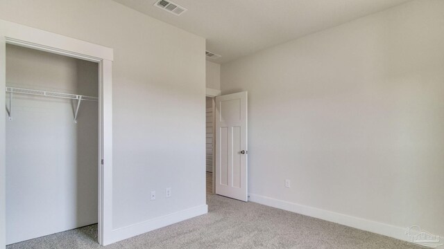 1674 Amaya Ln, Gulf Breeze, FL 32563 - unfurnished bedroom featuring carpet floors, a closet, and baseboards