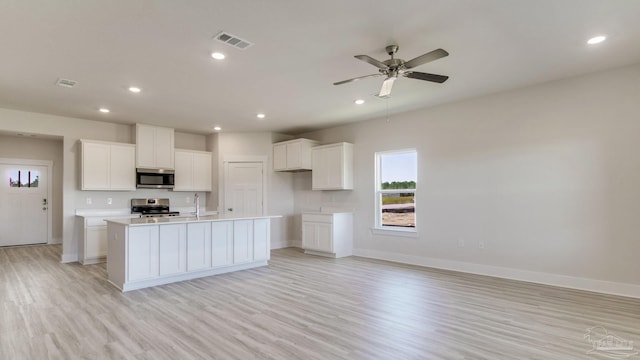 1674 Amaya Ln, Gulf Breeze, FL 32563 - kitchen with appliances with stainless steel finishes, light wood-style flooring, baseboards, a sink, and recessed lighting
