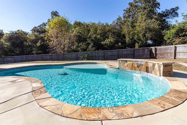 view of pool with pool water feature