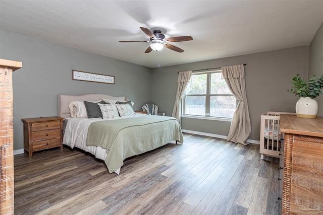 bedroom featuring hardwood / wood-style floors and ceiling fan