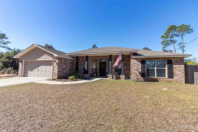 view of front of house with a front yard and a garage