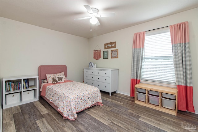 bedroom with ceiling fan and dark wood-type flooring