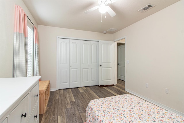 bedroom featuring ceiling fan, a closet, and dark hardwood / wood-style floors