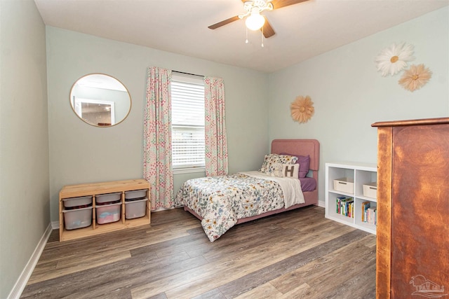 bedroom with ceiling fan and dark wood-type flooring