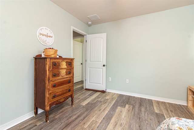 bedroom featuring dark wood-type flooring