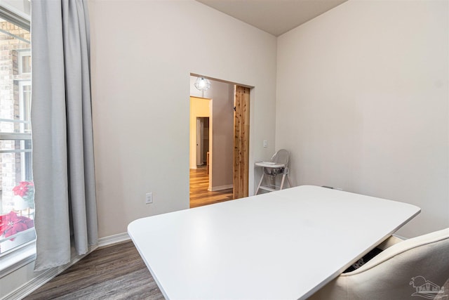 bedroom with dark hardwood / wood-style flooring