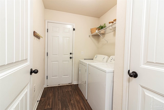 laundry room featuring washing machine and dryer and dark hardwood / wood-style floors