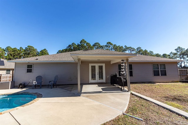 back of house with french doors and a patio area