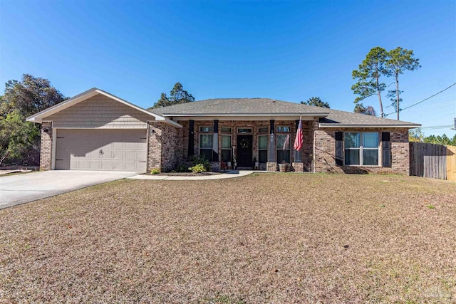 view of front of home with a garage and a front lawn