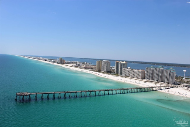 bird's eye view with a water view and a beach view