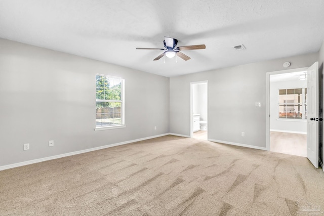 9001 Thompson Dr, Pensacola, FL 32534 - unfurnished bedroom with carpet flooring, ensuite bathroom, and baseboards
